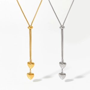 Dual heart pendant necklace in gold and silver finish with adjustable Y-shaped chain design