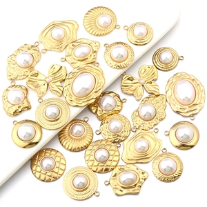 Macro detail of golden sunflower pendants with pearls for DIY jewelry making and crafts