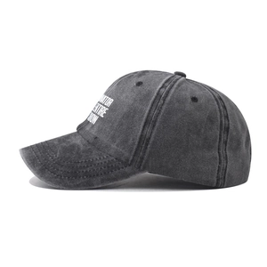 Detail shot of vintage washed charcoal grey baseball cap with side print texture