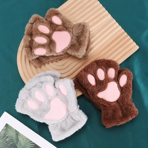 Detail of plush cat paw fingerless gloves in brown and grey with pink paw pads