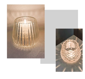 Close-up of glass candle holders with ribbed and diamond patterns for cozy dining