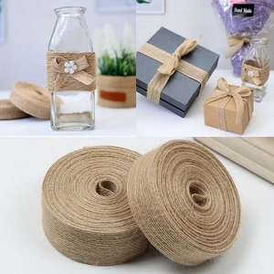 Macro detail of natural jute twine rolls and decorative gift box packaging scenes