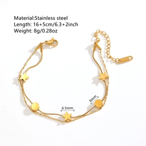 Double-layered gold stainless steel star and disk charm bracelet on a white background