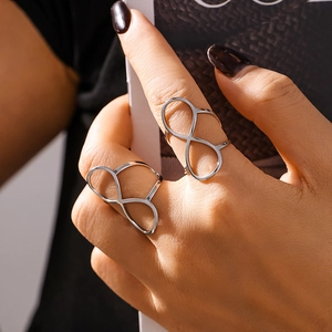 Silver infinity symbol open ring in stainless steel shown on model fingers