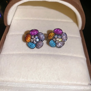 Sparkling silver needle flower earrings with colorful zircon stones in a velvet jewelry box