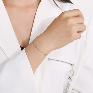 Detailed close-up of a silver beaded chain bracelet made of durable stainless steel