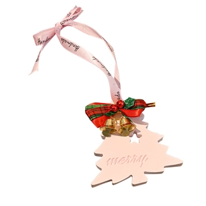Pink Christmas tree plaster ornament with red plaid bow and golden bells on white background