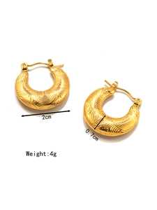 Detail of 18K gold-plated stainless steel hoop earrings with unique spiral texture finish