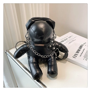 Detail of black bear PU leather bag featuring silver chain and punk rivet tie decoration