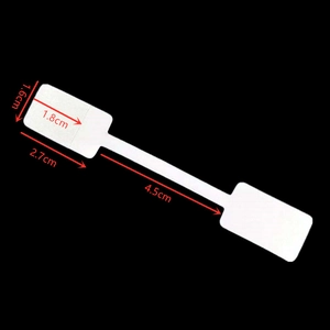 Detail view of dumbbell-shaped jewelry price tag with 1.6cm by 1.8cm size measurements