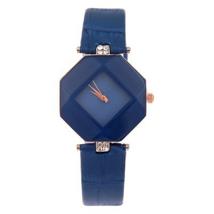 Detail of blue geometric multifaceted watch case with crystal accents and leather strap