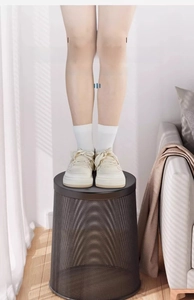 Strong metal mesh waste bin showing high load-bearing capacity with person standing on it