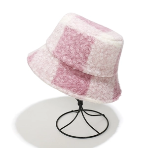 Detail of pink and white checkered teddy fleece bucket hat with soft textured fabric