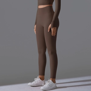 Deep brown high-waist yoga set featuring long sleeves with ergonomic thumbholes