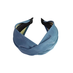 Minimalist wide cross twisted headband in soft blue faux leather with non-slip inner grip
