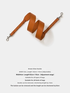 Adjustable brown leather strap detail with rotating silver hardware and 4cm width