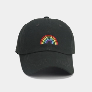 Close-up of rainbow embroidery on a black twill cotton baseball cap with curved brim