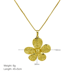 Golden five-petal flower pendant necklace with size details on a clean white background
