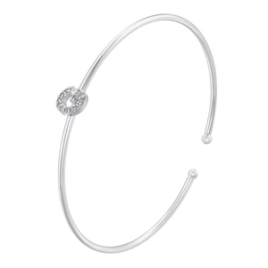 Detail of silver-plated open bangle featuring a sparkling cubic zirconia letter G charm
