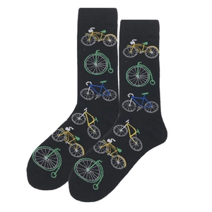 Detailed macro view of black cotton socks featuring colorful embroidered vintage bicycles