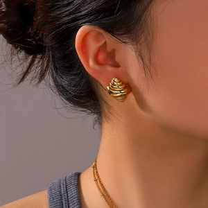 18K gold plated stainless steel ocean theme conch shell earrings on female model