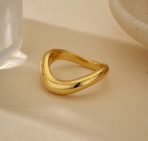 Macro shot of minimalist wavy S925 sterling silver ring showing the inner metal hallmark