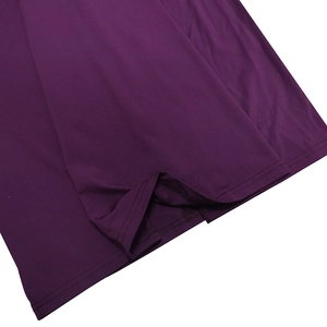 Close-up of the smooth purple fabric hem showing professional double-needle stitching detail