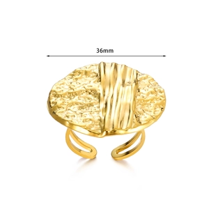 Macro view of 36mm oversized golden geometric ring with hammer texture and adjustable band