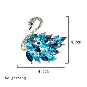Detailed size view of swan brooch with blue crystals and white rhinestones, 4.3cm height
