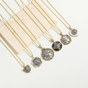 Close-up of vintage gold coin necklaces with portrait reliefs and pearl accents