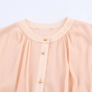 Elegant apricot pleated midi dress with round neck and gold bead buttons detail