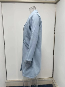 Side view of light blue long wool coat with lapel collar on a female mannequin