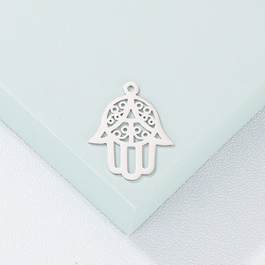 Polished silver stainless steel Hamsa Hand pendant with intricate hollow cutouts
