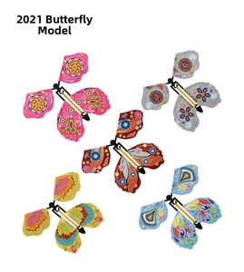 Set of five vibrant magic flying butterfly toys with colorful patterns and elastic bands