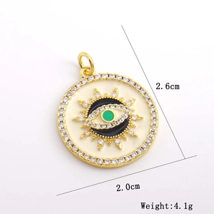 Detail showing 2.0cm evil eye sunburst pendant with zircon and enamel in gold finish