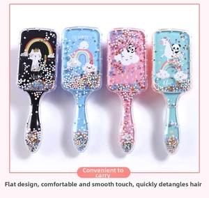 Detail view of 4-piece set of cartoon hair brushes with glitter and cute animal prints