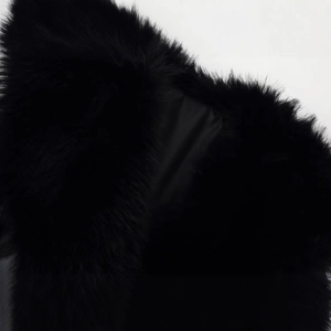 Chic women's faux fur coat in black with plush shearling texture for autumn winter season