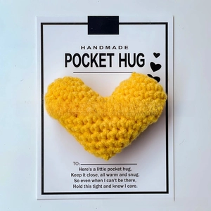Detail of yellow crocheted heart on white Pocket Hug card with handmade greeting poem