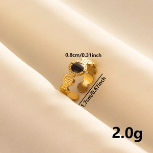 Detail view of gold retro ring with black circular inlay and product size specifications