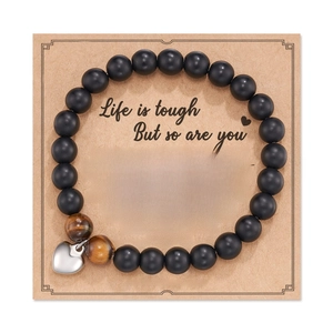 Handmade pink zebra heart charm bracelet with matte black beads and healing card