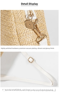 Detailed macro view of woven straw bag with high-polish gold hardware and white leather strap