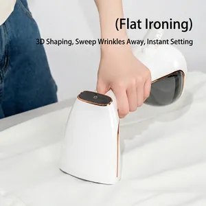White handheld garment steamer with rose gold accents being used for flat ironing clothes