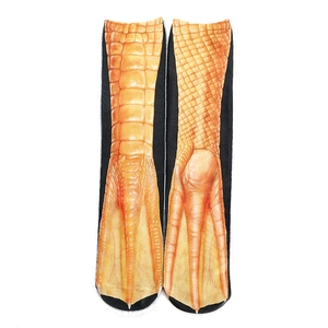Detailed view of novelty chicken claw socks with realistic orange and black animal prints