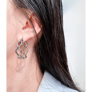 Fashionable silver double wavy hoop earrings with metal texture for a stylish modern look