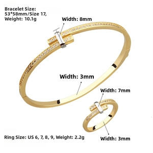 Detailed close-up of gold-plated copper bracelet and ring set with sparkling zircon inlays