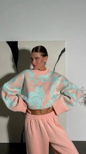 Detailed knit texture of pink and mint rabbit sweater with elasticated waist pants