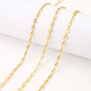 Detailed view of 18k gold coffee bean link chain wrapped on a white cylinder stand