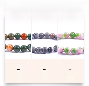 Macro detail of 8mm natural stone beads showing marble and agate textures in three colors