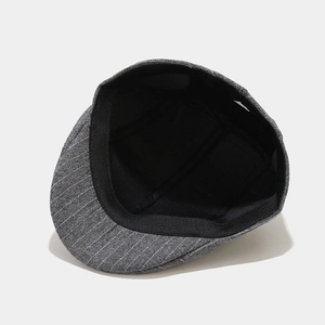 Classic dark grey pinstripe flat cap featuring a vintage British newsboy style design