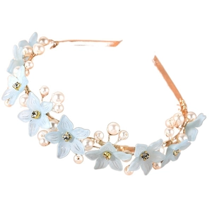 Close-up of handmade floral headband with light blue flowers and white pearls